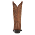 Brown cowboy boot with intricate embossing on a white background