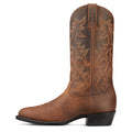 Brown cowboy boot with intricate embossing on a white background