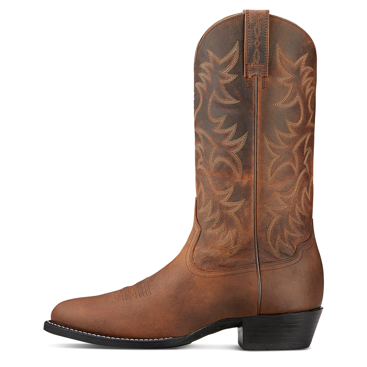Brown cowboy boot with intricate embossing on a white background