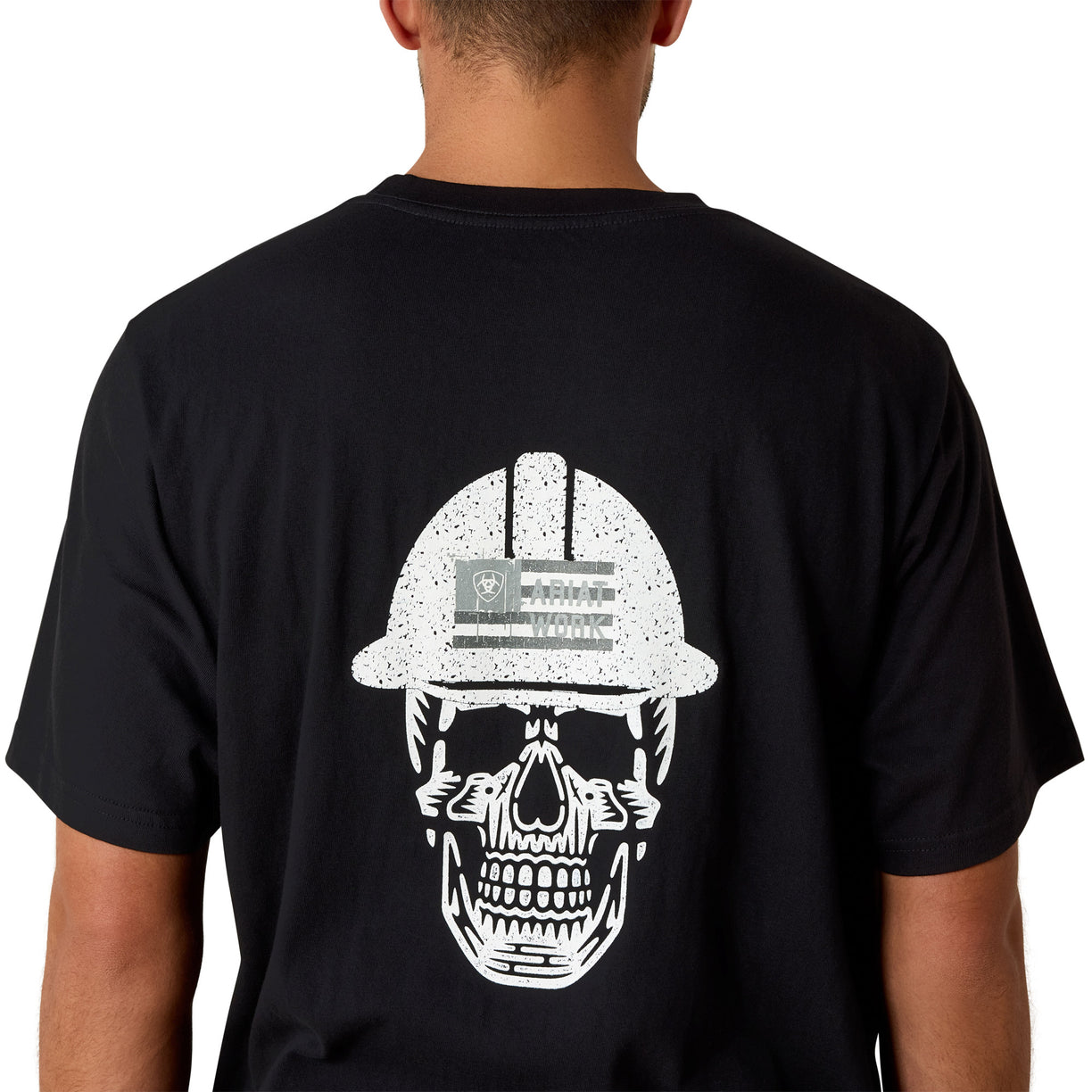 Black t-shirt with a white skull design wearing a hard hat on the back, displayed on a person.
