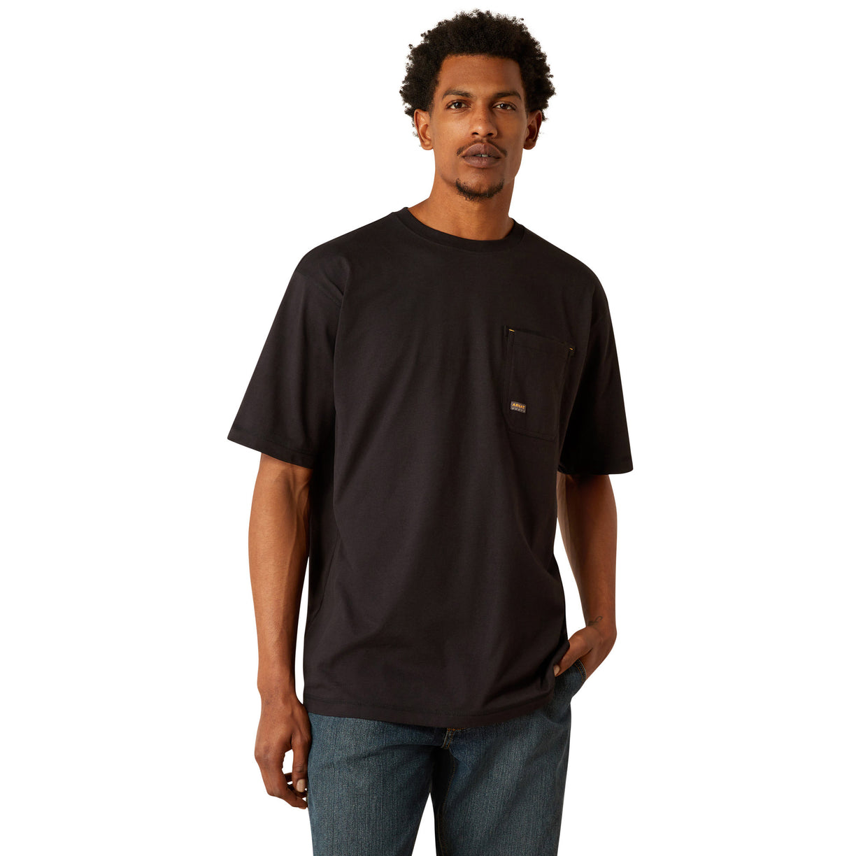 Person wearing a black t-shirt with 'Ariat Work' text on the back, standing against a white background