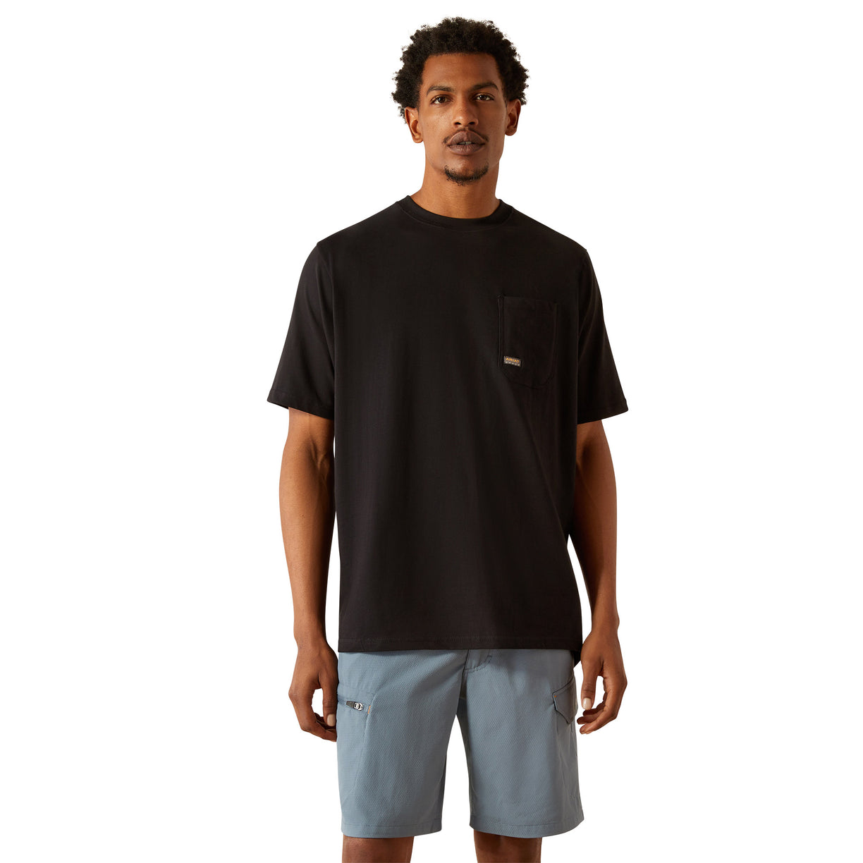 Person wearing a black t-shirt with a skull and hard hat graphic on the back.