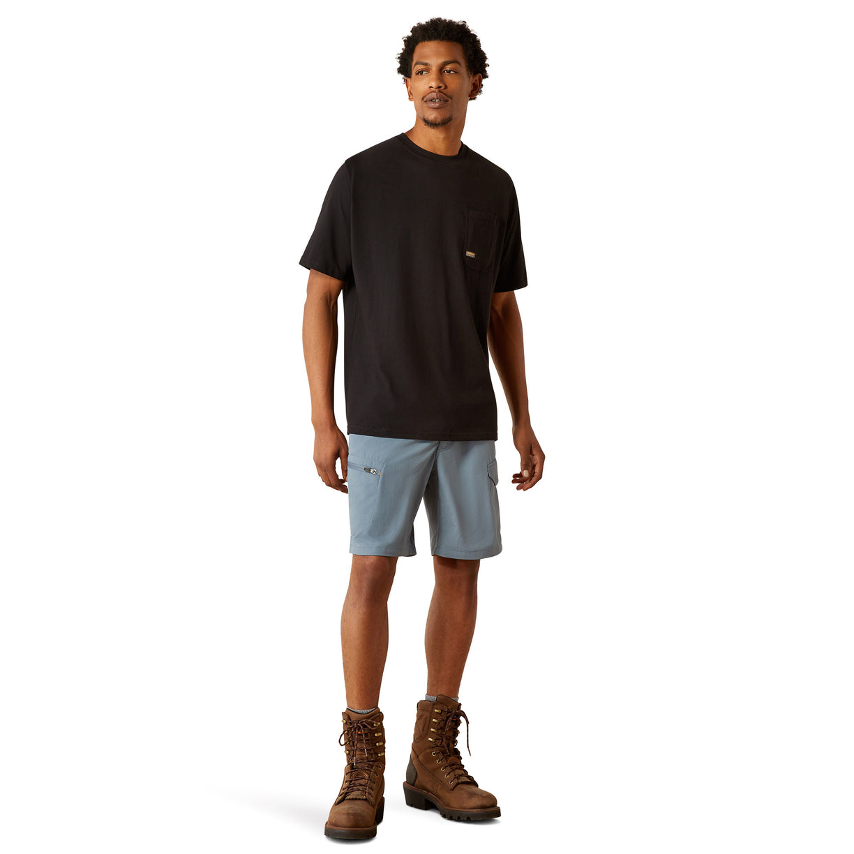 Person wearing a black t-shirt with a skull and hard hat graphic on the back.