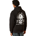 Person wearing a black hoodie with a skull and hard hat design on the back, on a white background.