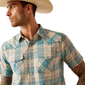 Man wearing a plaid shirt and cowboy hat on a white background