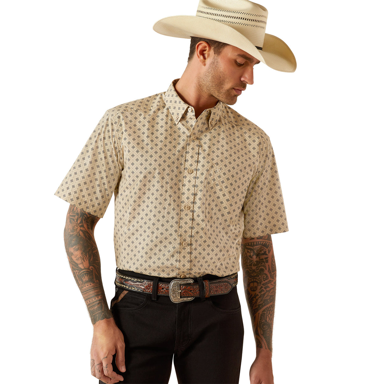 Man wearing a patterned shirt, black pants, and a cowboy hat on a white background