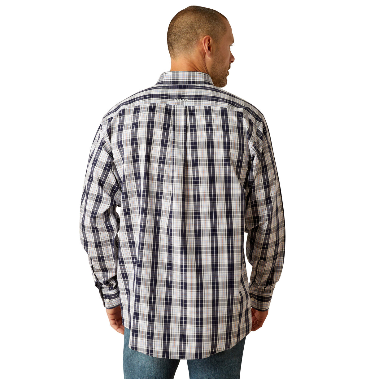 Man wearing a plaid shirt and jeans on a white background