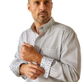 Man wearing a checkered shirt and jeans on a white background