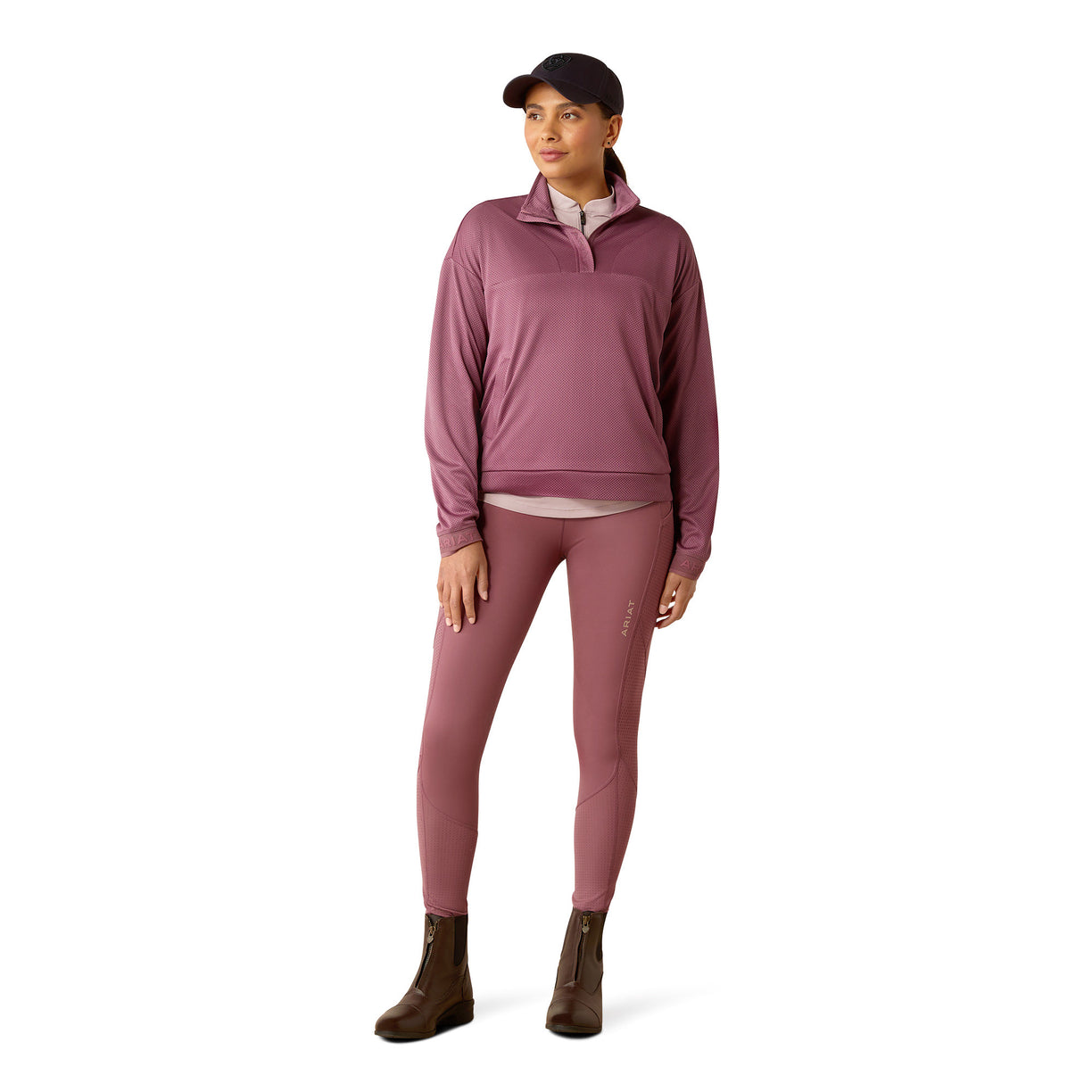 Pink leggings worn by a person on a white background
