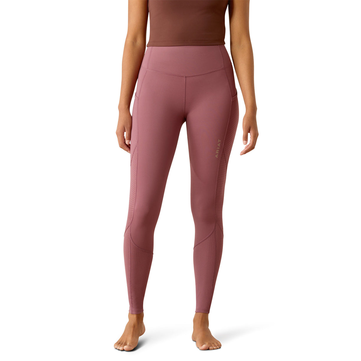 Pink leggings worn by a person on a white background
