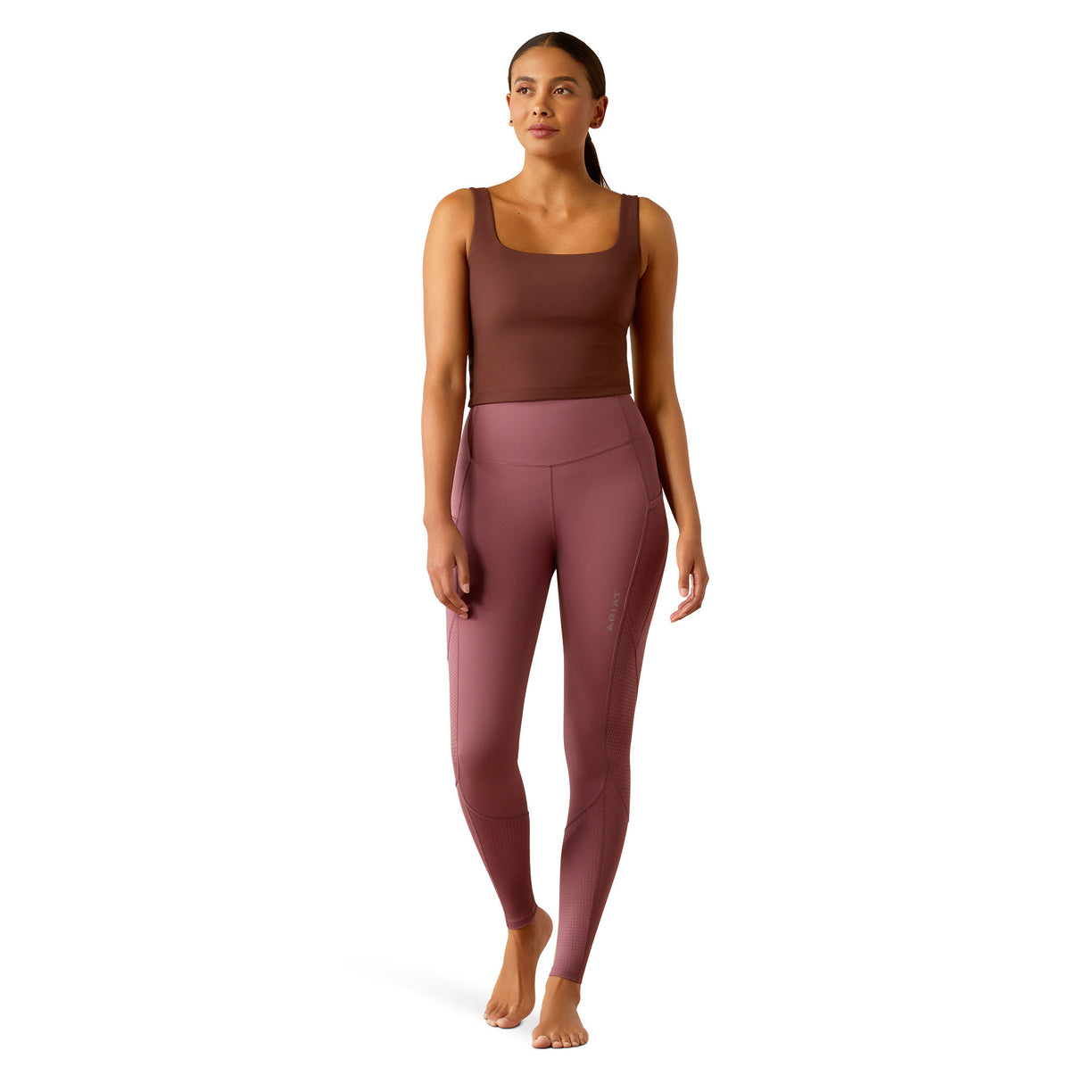 Pink leggings worn by a person on a white background