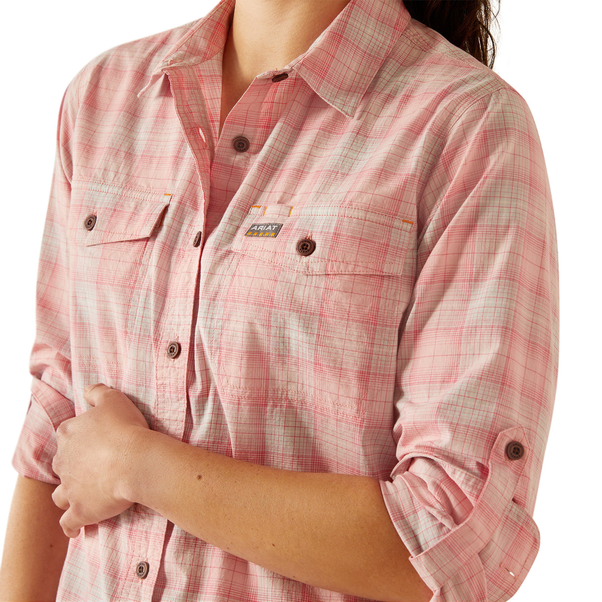 Person wearing a pink plaid shirt on a white background