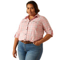 Person wearing a pink plaid shirt on a white background