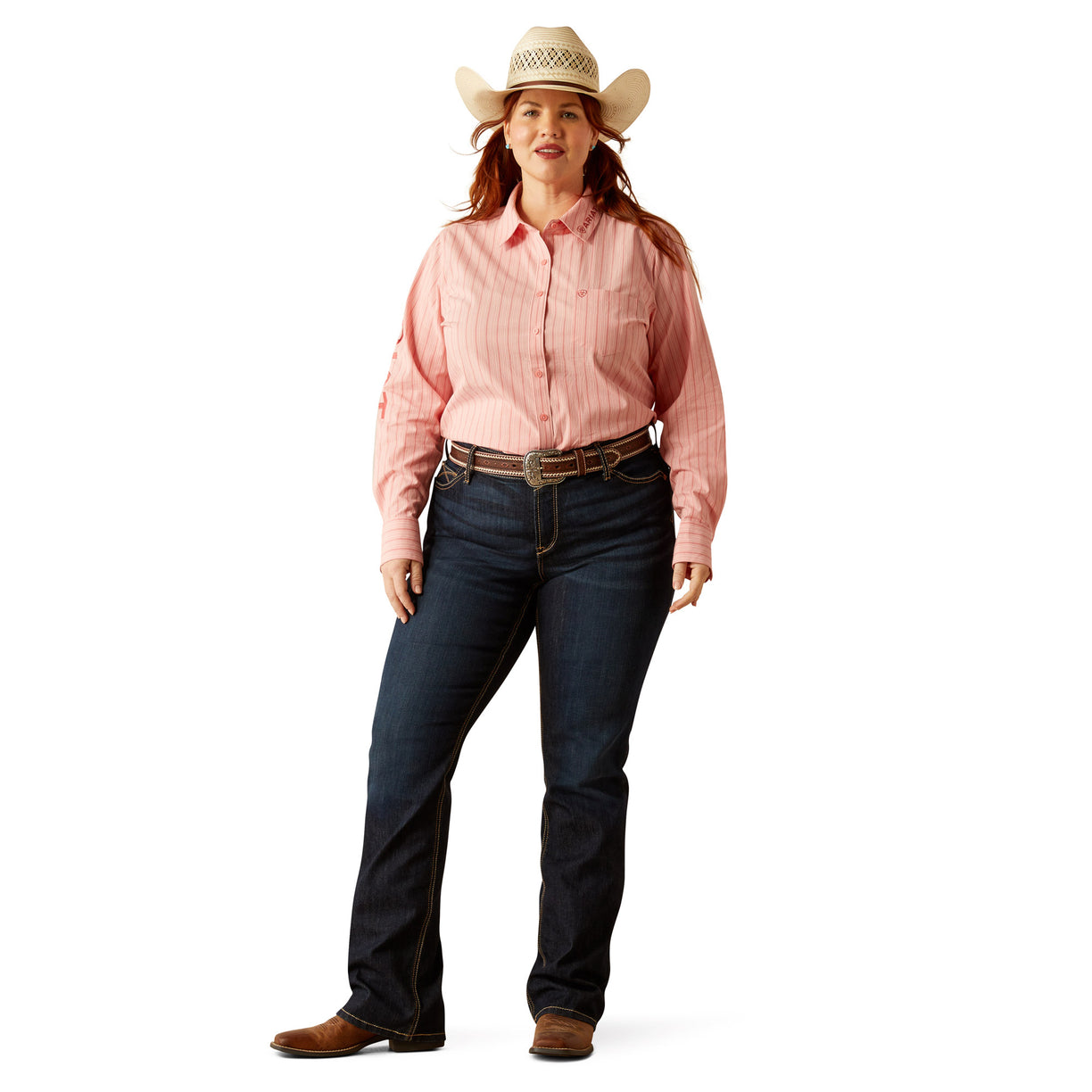 Woman wearing a pink long-sleeve shirt, blue jeans, and a white cowboy hat on a white background