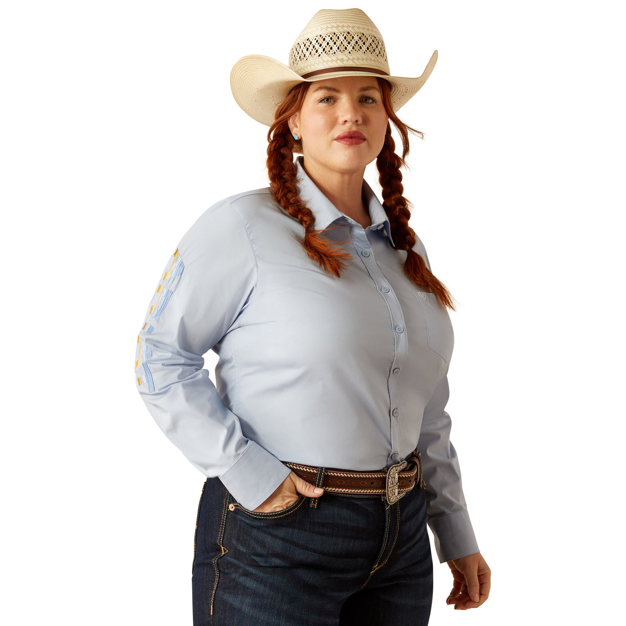 Woman wearing a light blue shirt and jeans on a white background