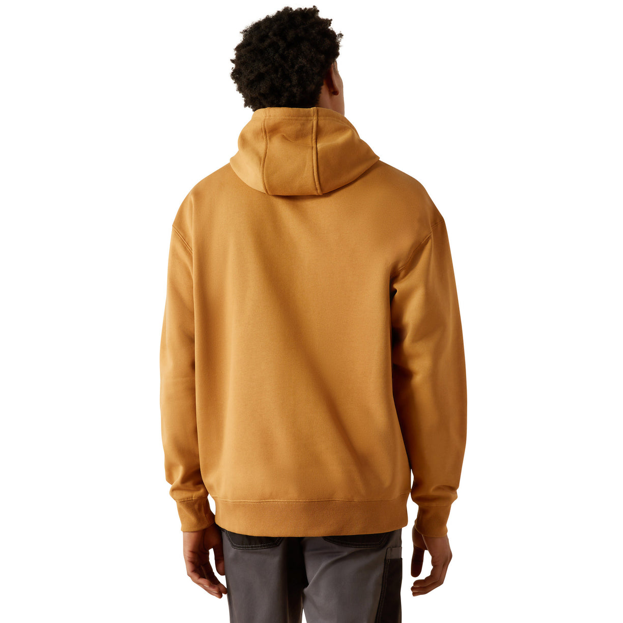 Man wearing a mustard yellow hoodie with Ariat branding on a white background
