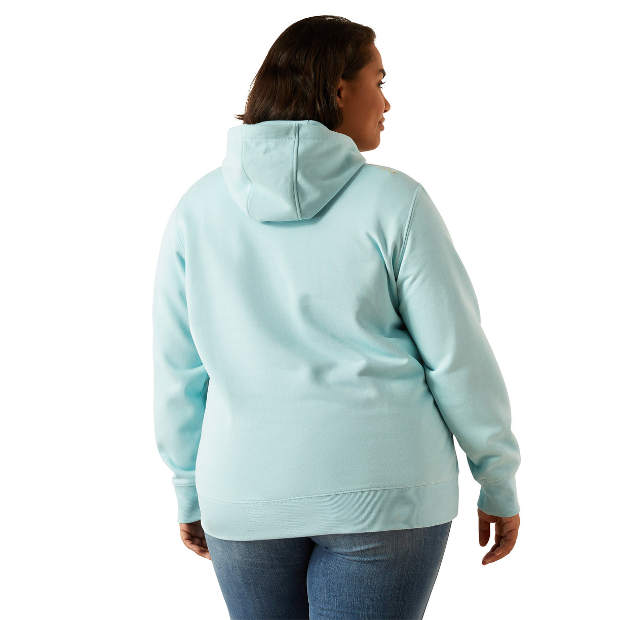 Person wearing a light blue hoodie with 'Ariat' branding on a white background