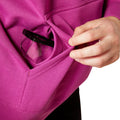Person wearing a pink hoodie with Ariat brand logo on a white background