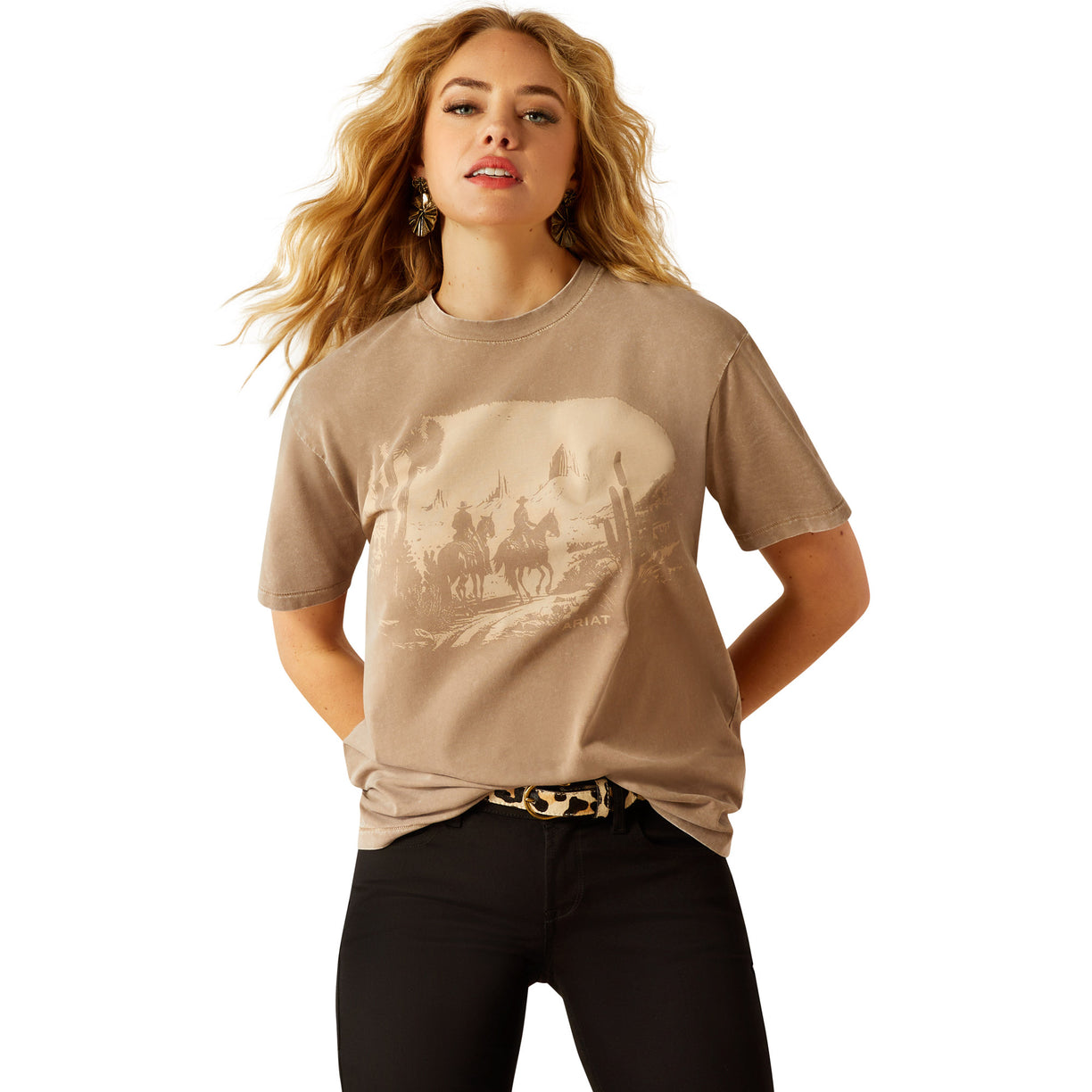 Woman wearing a beige t-shirt with a graphic design on a white background