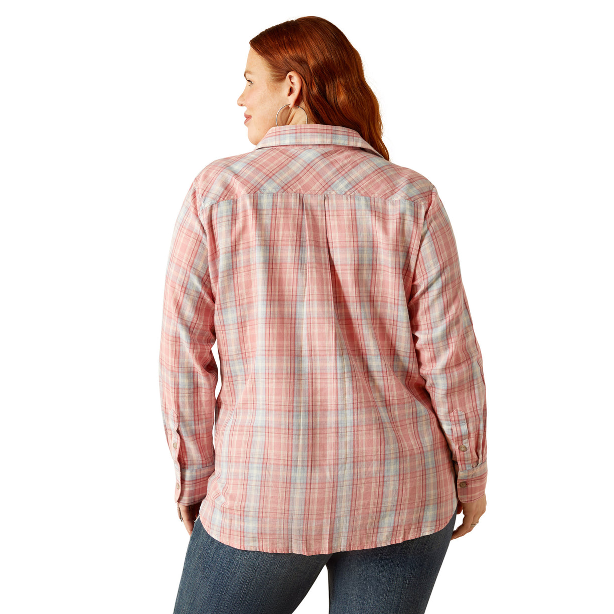 Woman wearing a pink plaid shirt on a white background