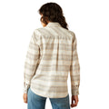 Person wearing a plaid shirt with a white background