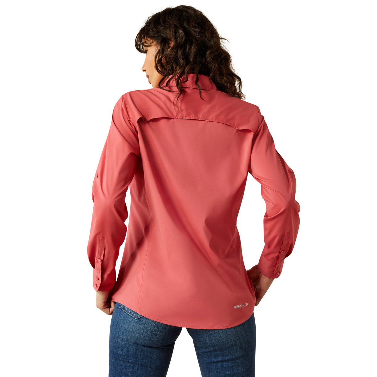 Woman wearing a red shirt and blue jeans on a white background