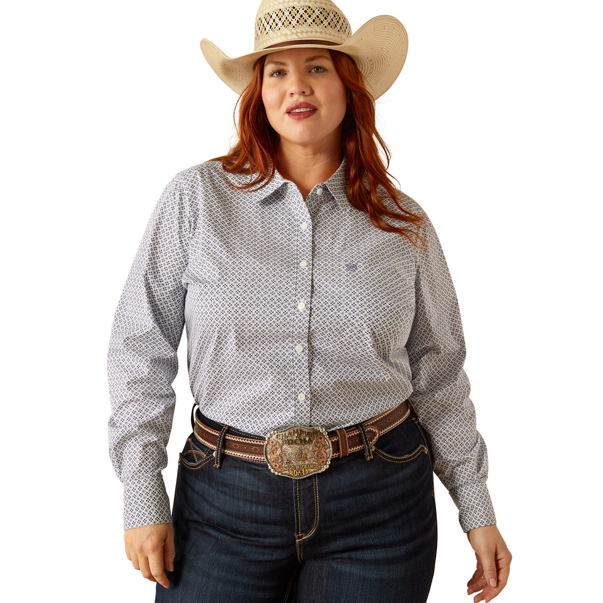 Woman wearing a patterned shirt, jeans, and a cowboy hat on a white background