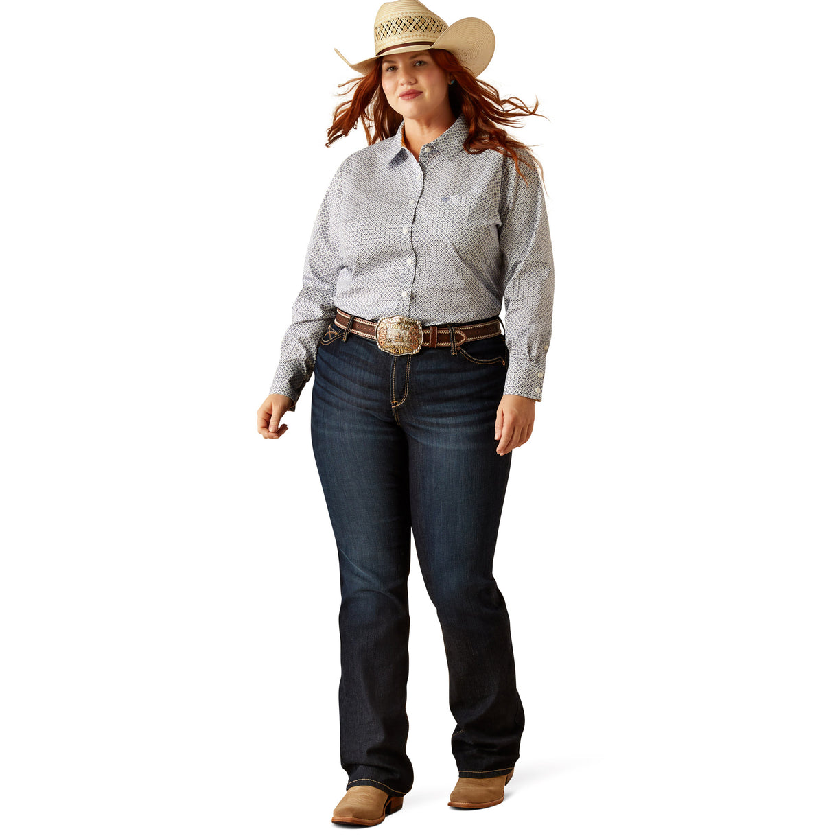 Woman wearing a patterned shirt, jeans, and a cowboy hat on a white background