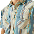 Close-up of a person wearing a striped shirt with a focus on the collar and chest pocket.