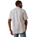 Man wearing a plaid shirt and jeans on a white background