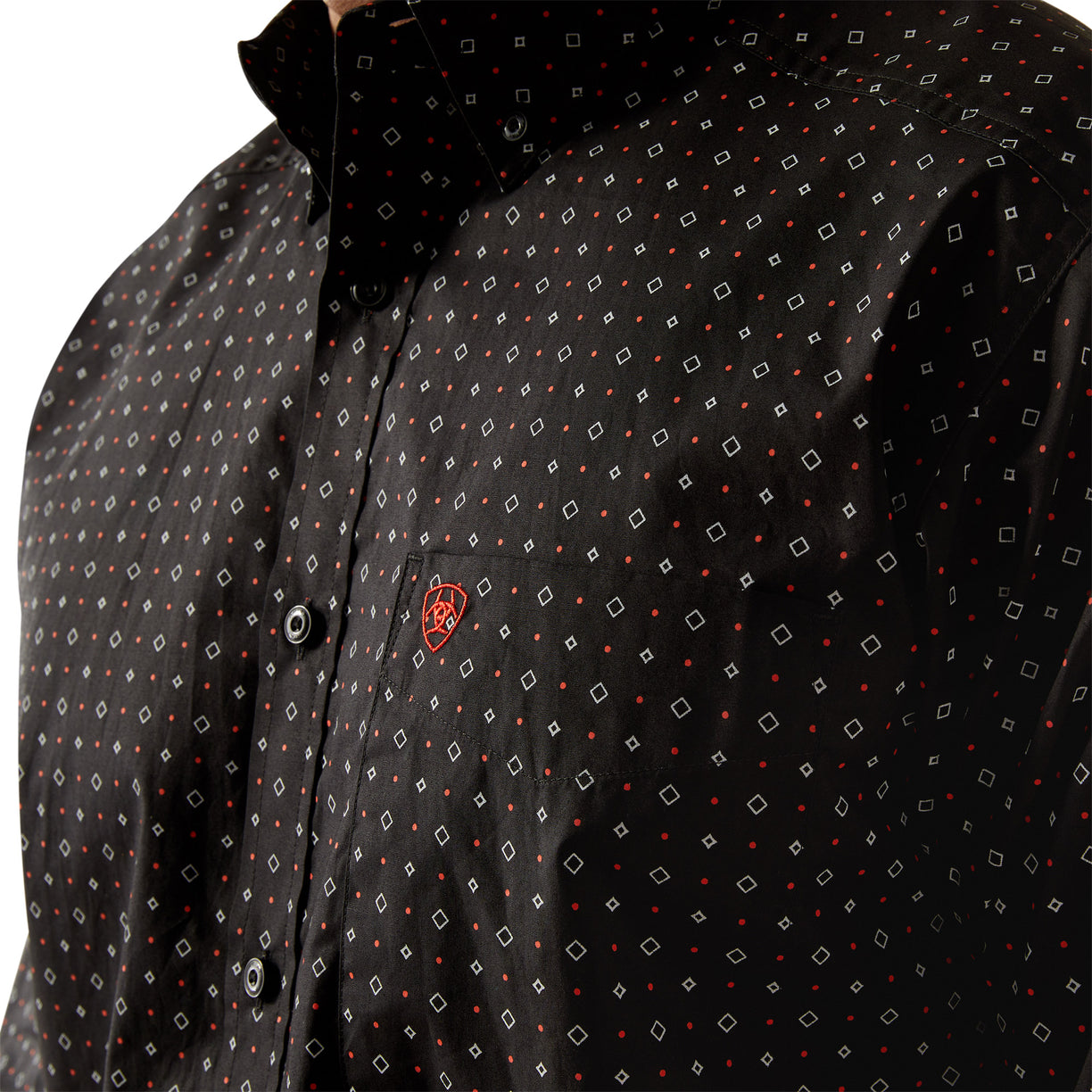 Black patterned shirt with a brand logo on a white background