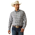 Man wearing a plaid shirt, jeans, and a cowboy hat on a white background
