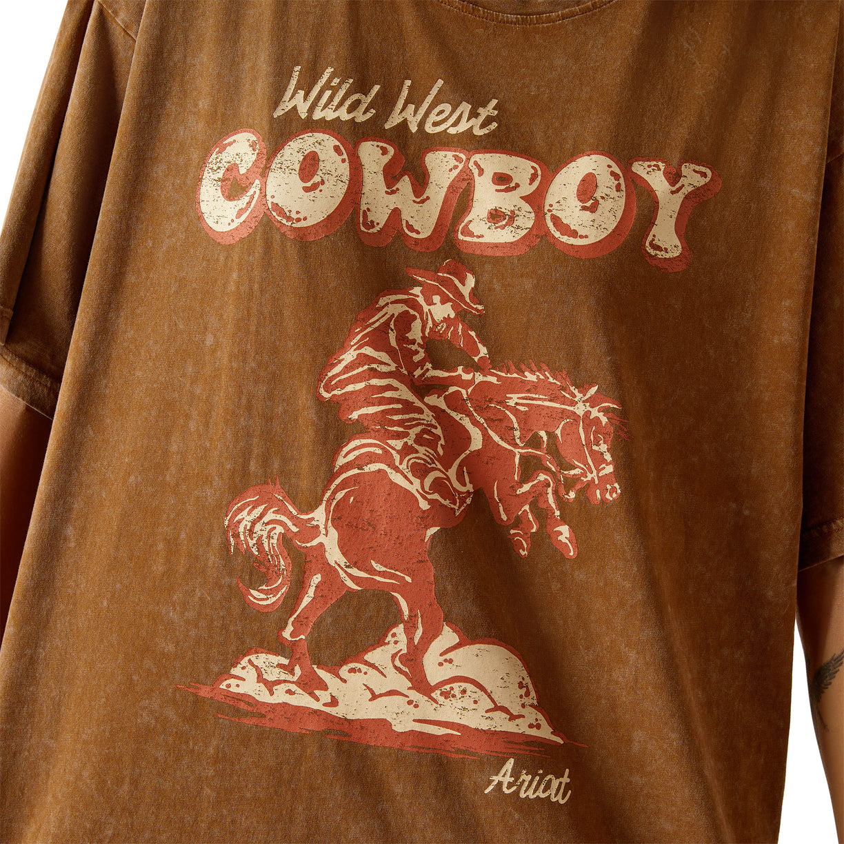Brown t-shirt with 'Wild West Cowboy' text and graphic of a cowboy on a horse.