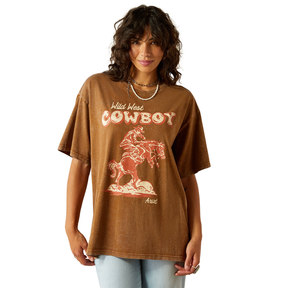 Woman wearing a brown t-shirt with a graphic design and text on a white background