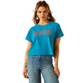 Woman wearing a blue t-shirt with 'COWGIRL' text on a white background