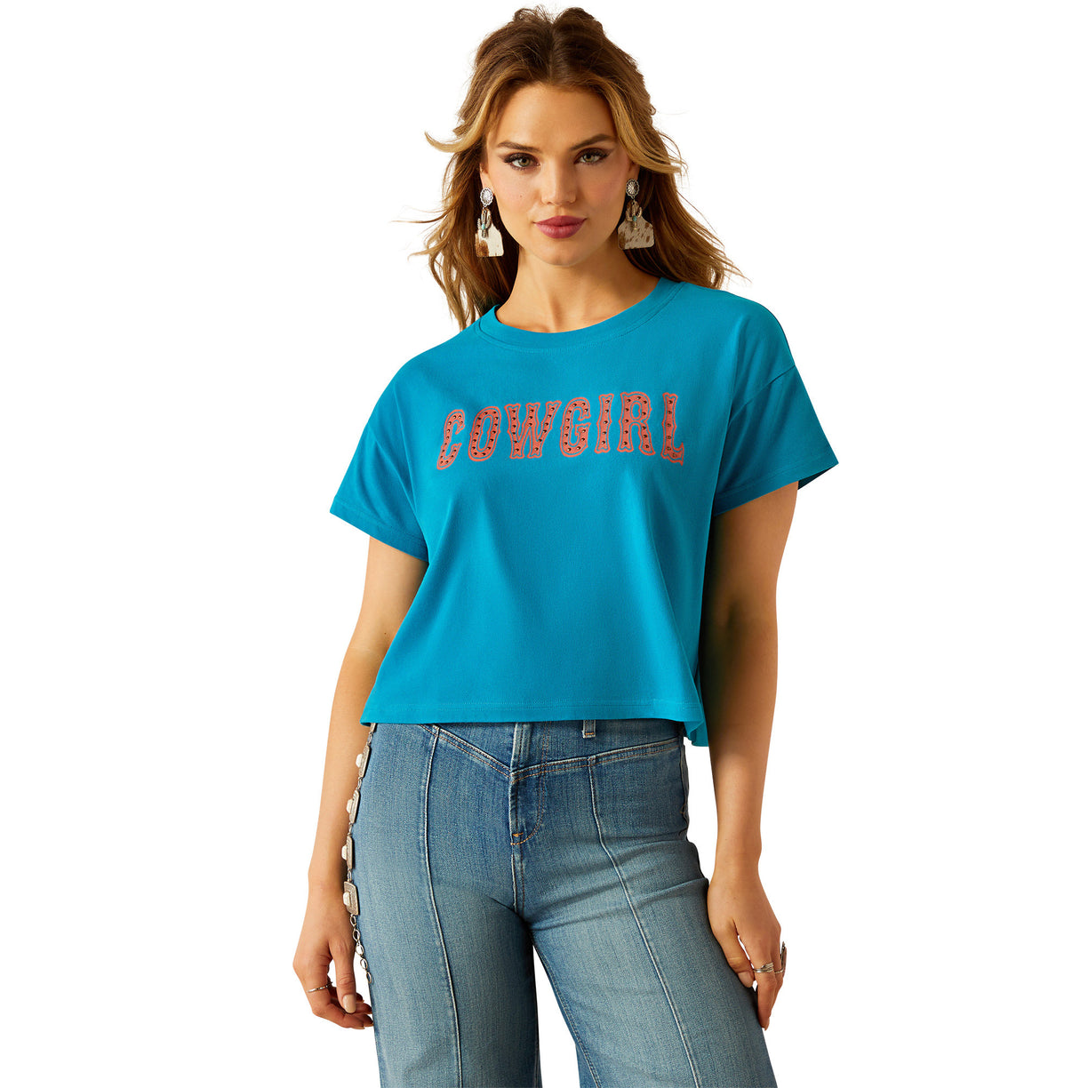 Woman wearing a blue t-shirt with 'COWGIRL' text on a white background