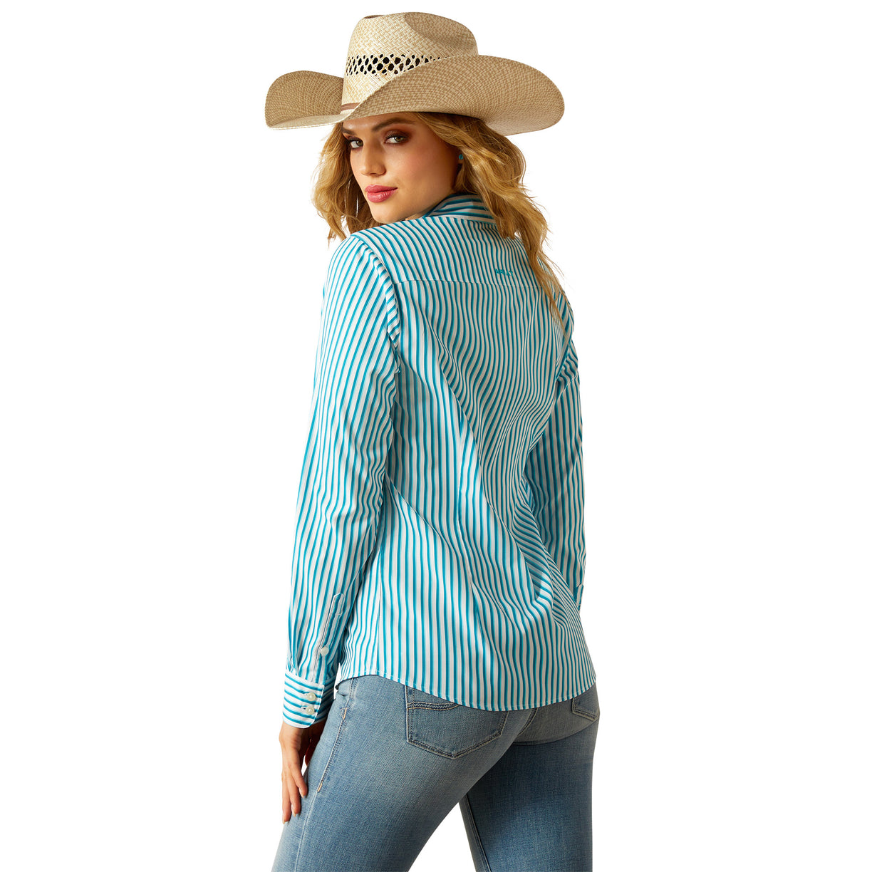 Woman wearing a turquoise striped shirt and jeans with a cowboy hat on a white background