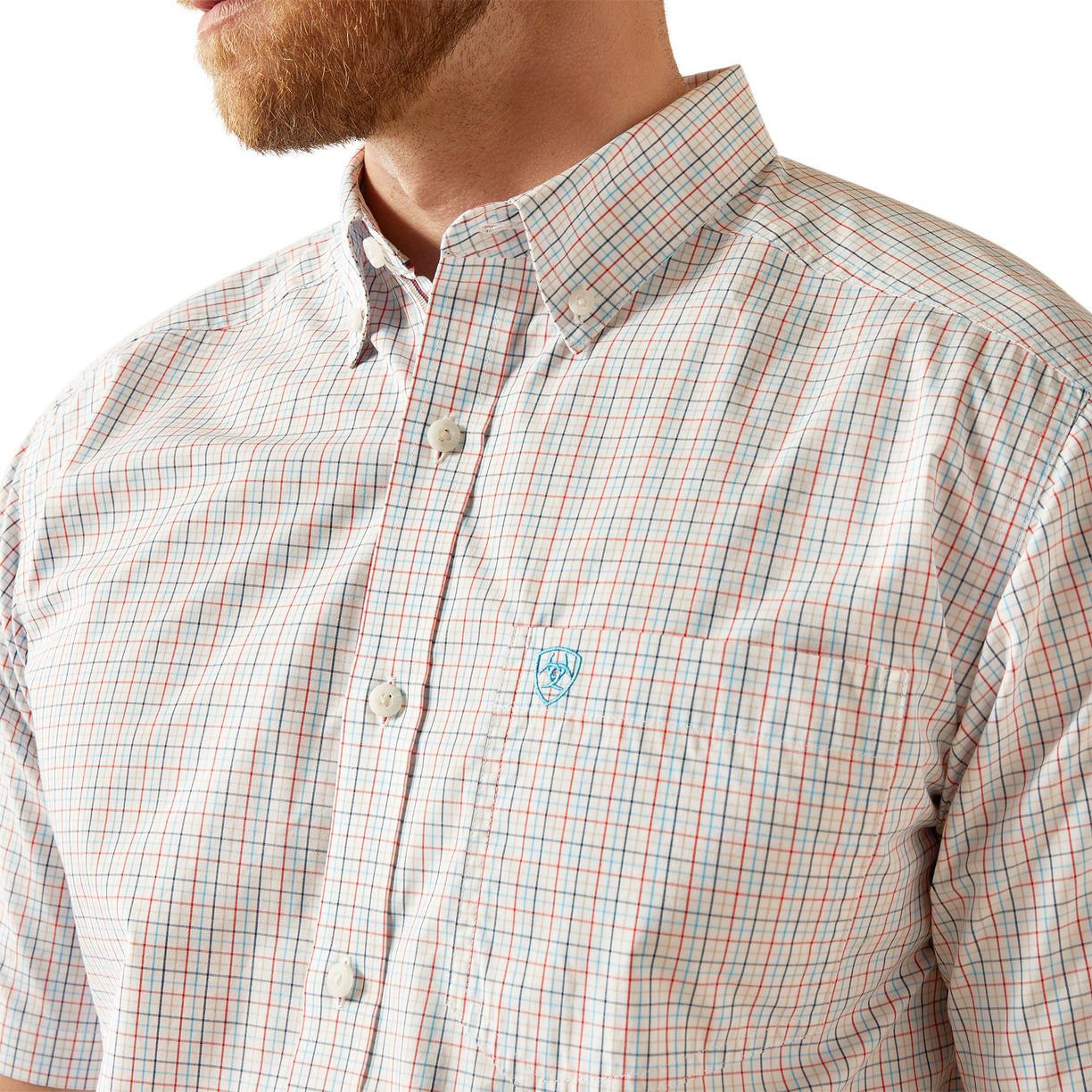 Close-up of a man wearing a plaid shirt with a brand logo on a white background