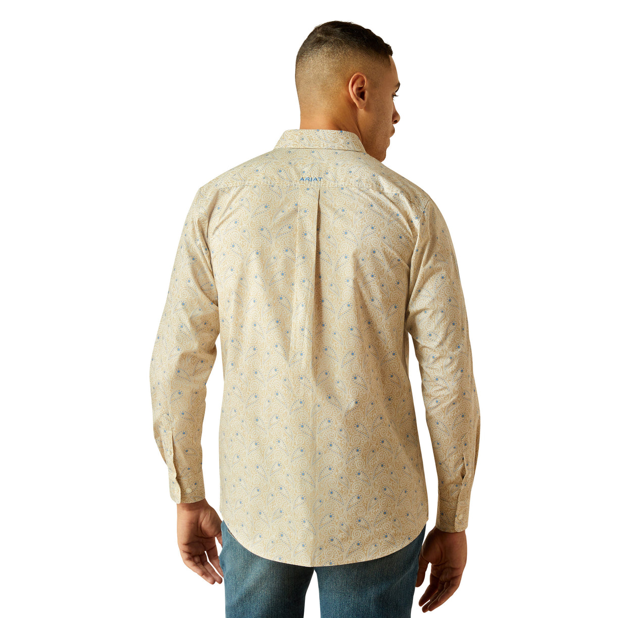 Man wearing a beige patterned shirt on a white background