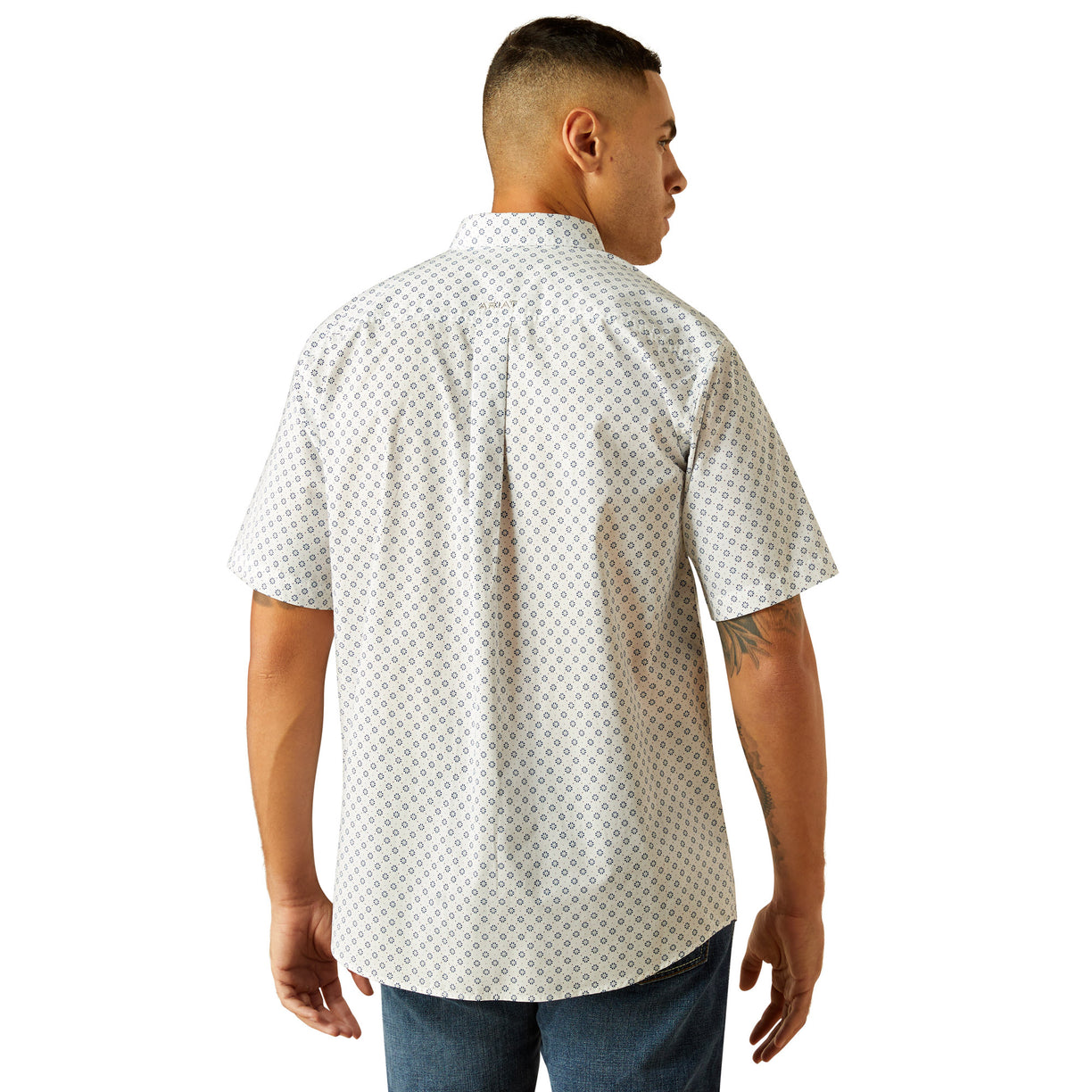 Man wearing a white patterned shirt on a white background