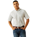 Man wearing a patterned shirt and jeans on a white background