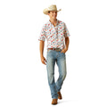Man wearing a patterned shirt, jeans, and a cowboy hat on a white background
