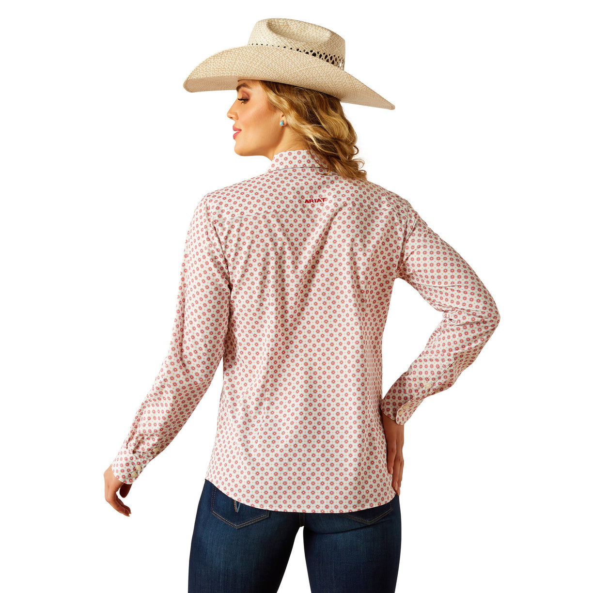 Woman wearing a patterned shirt and cowboy hat on a white background