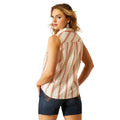 Woman wearing a sleeveless striped shirt and denim with a cowboy hat on a white background