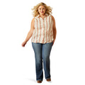 Woman wearing a sleeveless striped shirt and denim with a cowboy hat on a white background