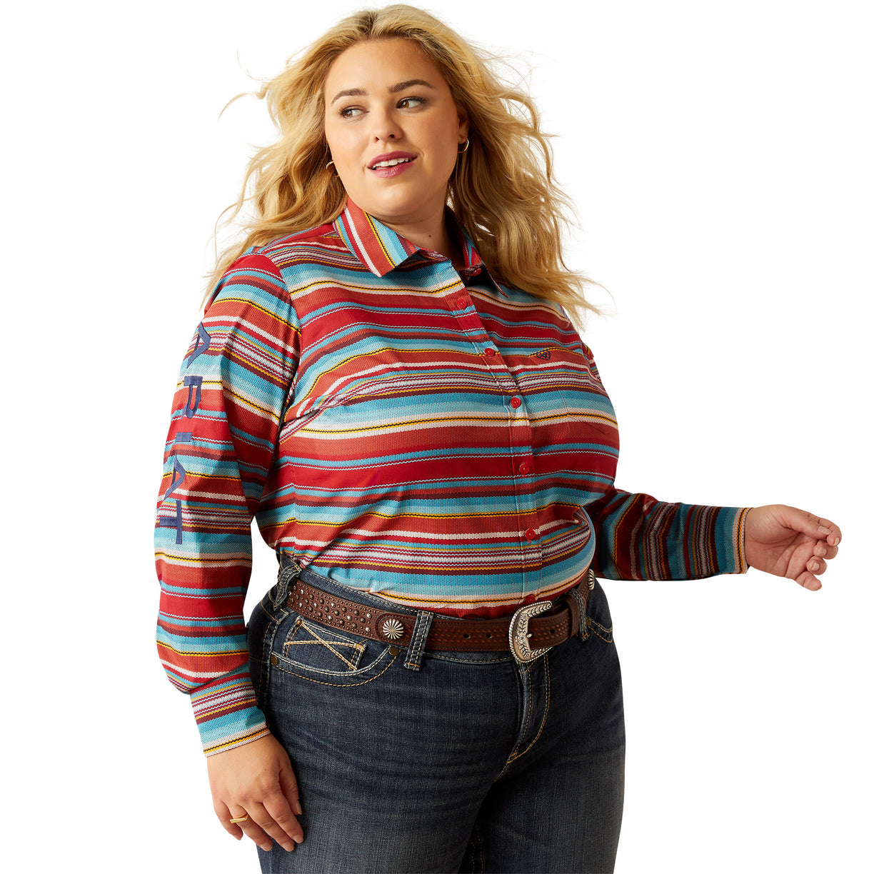 Woman wearing a colorful striped shirt and jeans on a white background