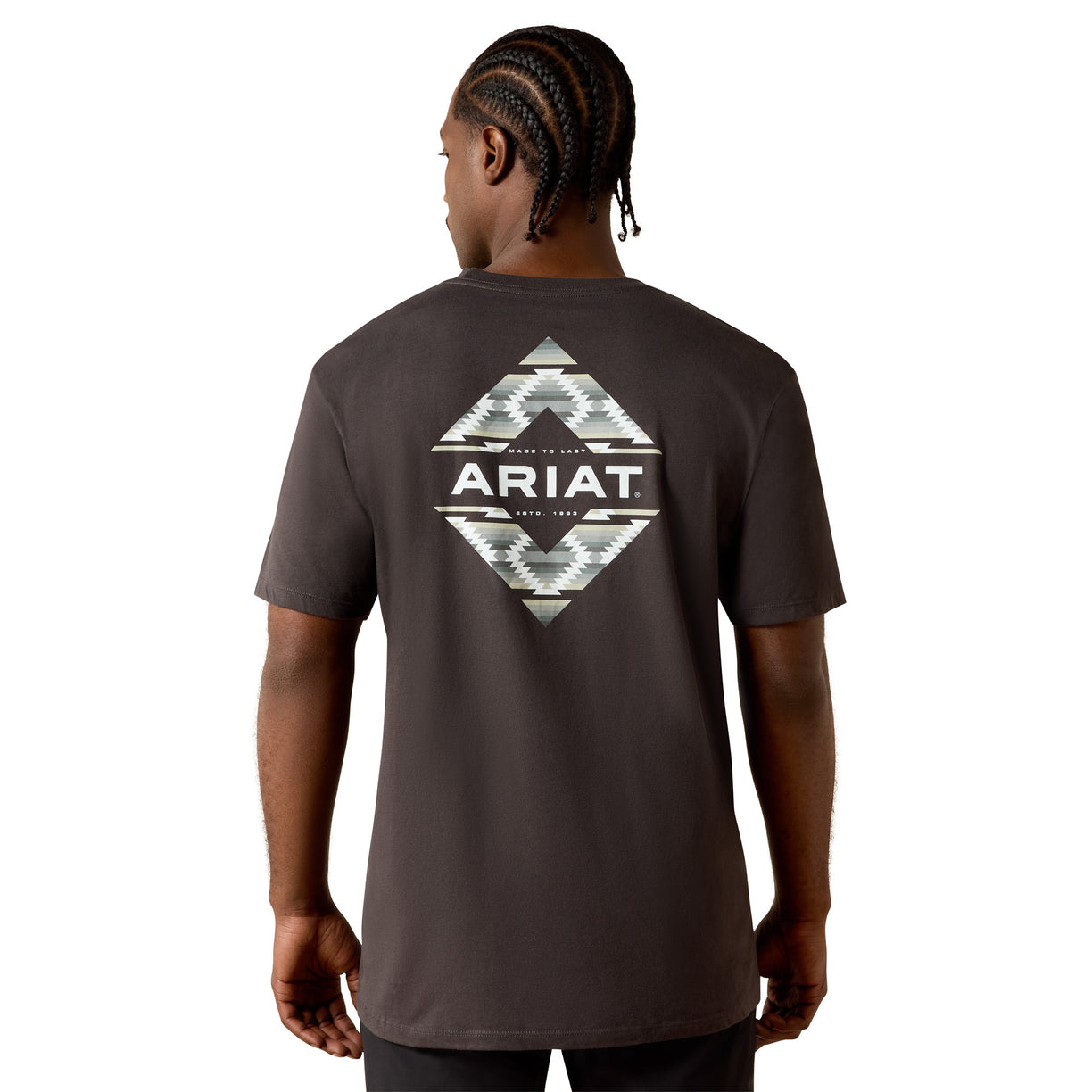 Person wearing a dark gray t-shirt with Ariat logo on the back, on a white background
