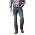 Person wearing blue jeans and a plaid shirt with a belt and boots on a white background