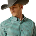 Man wearing a green plaid shirt and gray cowboy hat on a white background
