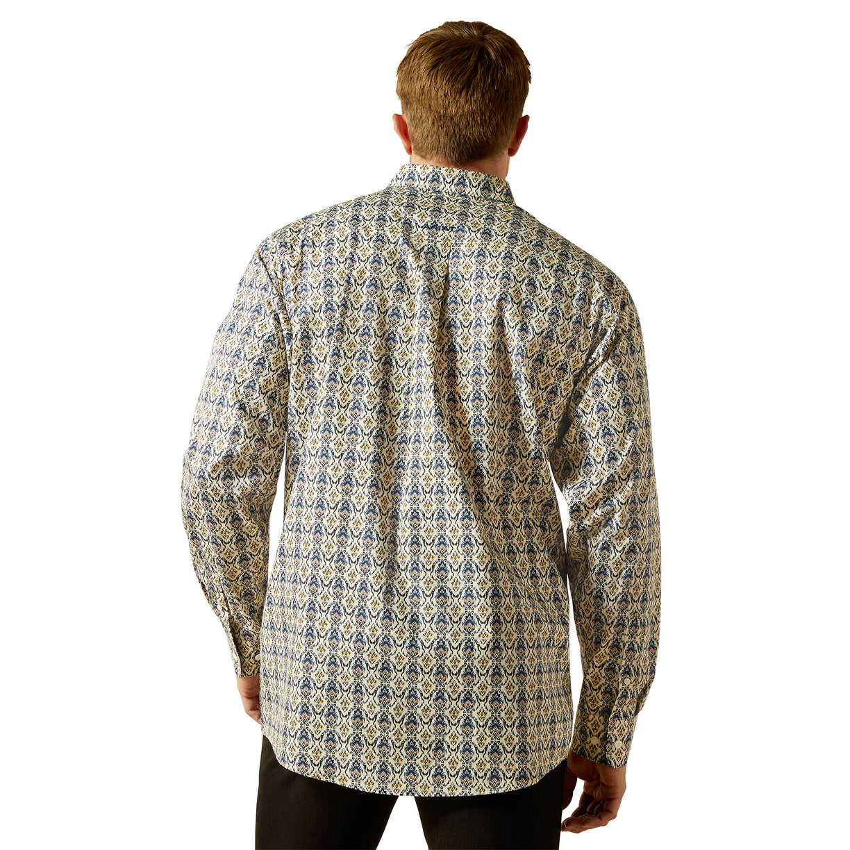 Man wearing a patterned shirt on a white background